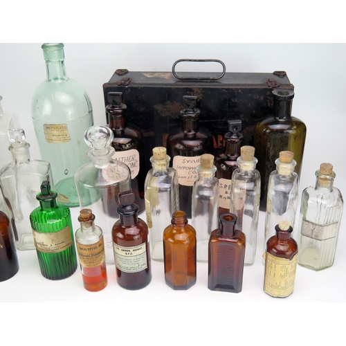 1328 - A collection of clear and brown glass pharmaceutical bottles, medicine bottles, metal first aid box ... 