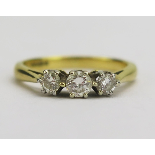 144 - An 18ct Gold and Diamond Three Stone Ring, largest brilliant cut c. 3.8mm, hallmarked, size J.75, 3.... 