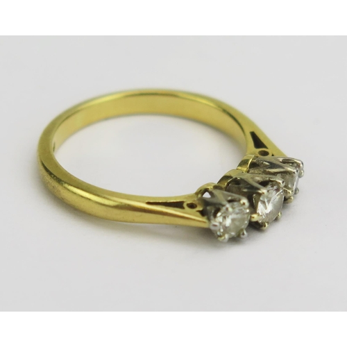 144 - An 18ct Gold and Diamond Three Stone Ring, largest brilliant cut c. 3.8mm, hallmarked, size J.75, 3.... 