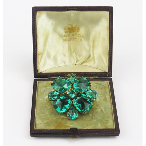 157 - A Cased Green Paste Brooch in a yellow metal mount, 39mm, Joseph Silvani of Brighton box