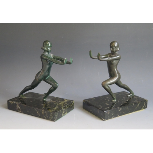 1622 - A pair of Art Deco period painted spelter bookends, modelled as nude females, raised on rectangular ... 