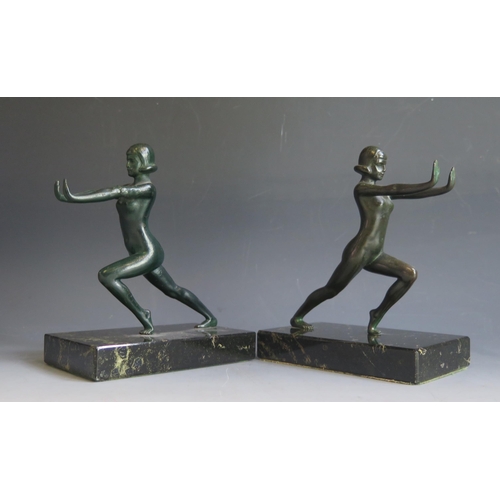 1622 - A pair of Art Deco period painted spelter bookends, modelled as nude females, raised on rectangular ... 