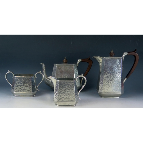 1627 - An Abbey beaten pewter four piece tea service includes teapot, hot water jug, sugar basin and cream ... 