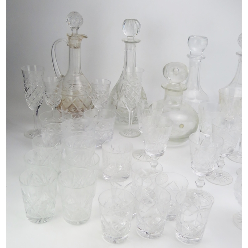 1636 - A collection of cut glass drinking vessels including wine glasses, tumblers, and assorted decanters.