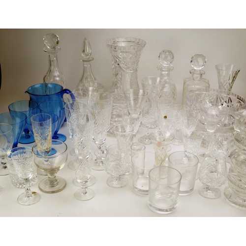 1637 - An extensive collection of assorted glass wares including decanters, wine glasses, fruit bowl cordia... 