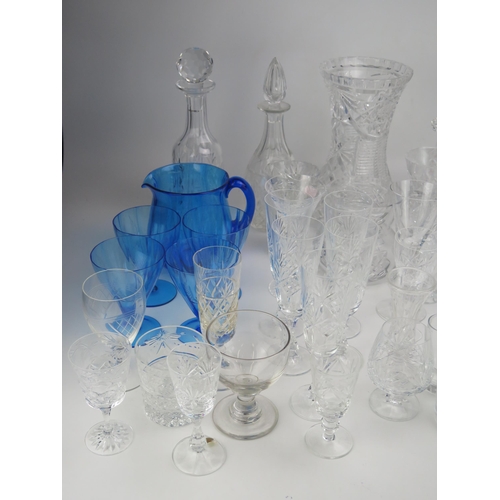 1637 - An extensive collection of assorted glass wares including decanters, wine glasses, fruit bowl cordia... 