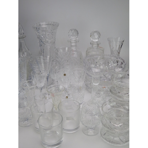 1637 - An extensive collection of assorted glass wares including decanters, wine glasses, fruit bowl cordia... 