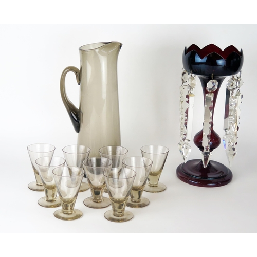 1641 - A Scandinavian  smoked glass cordial jug with nine matching tumblers, together with a ruby glass lus... 