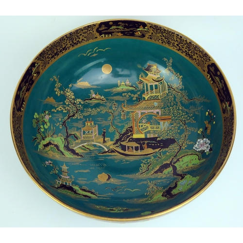 1650 - A Carlton ware fruit dish, decorated in the Chinoiserie taste with pagoda landscape, to a green grou... 