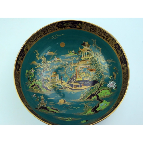 1650 - A Carlton ware fruit dish, decorated in the Chinoiserie taste with pagoda landscape, to a green grou... 