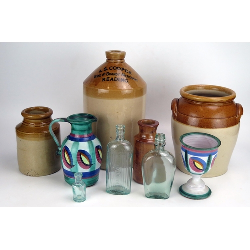 1652 - Four assorted stoneware storage  jars, glass bottles etc.