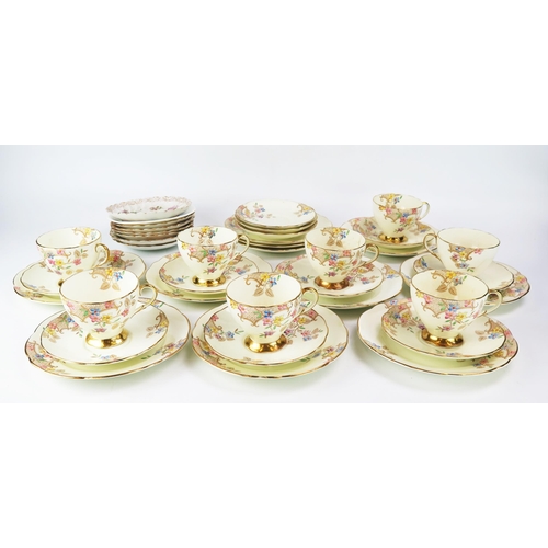 1658 - A Foley bone china part tea service with floral decoration heightened in gilt, includes eight cups a... 