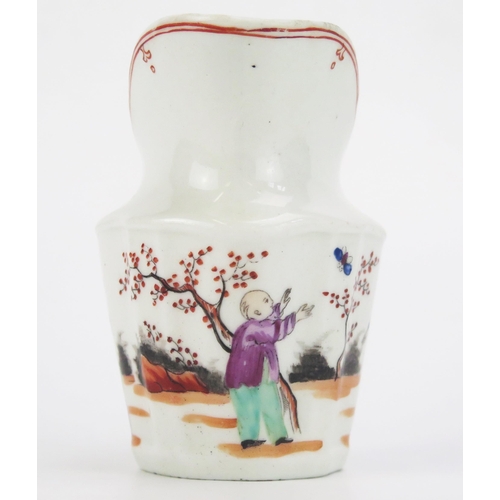 1664 - A late 18th century Newhall porcelain cream jug, with Chinoiserie painted decoration 10cm high.