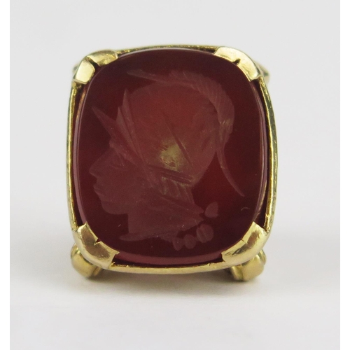 176 - A Hallmarked 9ct Gold and Carnelian Fob decorated with Romanesque helmeted soldier's head in profile... 