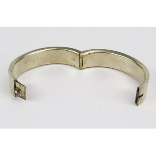 179 - A Victorian Precious White Metal Hinged Bangle, the inner rim engraved 