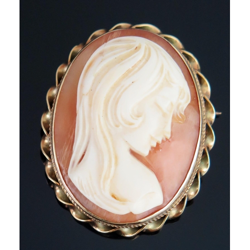 180 - A 9ct Gold Shell Cameo Brooch decorated with the busy of a lady in profile, 33.8x27.5mm, hallmarked,... 