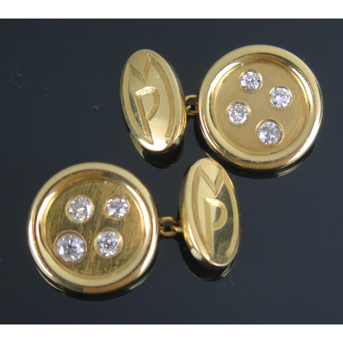 220 - A Pair of 18ct Gold and Diamond Cufflinks, each 20.8mm head set with four graduated old cut stones, ... 