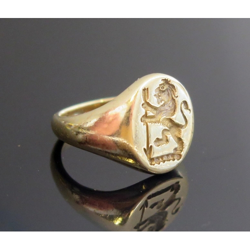 225 - A 9ct Gold Signet Ring engraved with a lion rampant supporting an arrow in pale point downwards (Ege... 