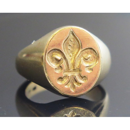 226 - A 9ct Gold Signet Ring engraved with a fleur-de-lis, size P.5, stamped marks, 14.73g and with a wax ... 