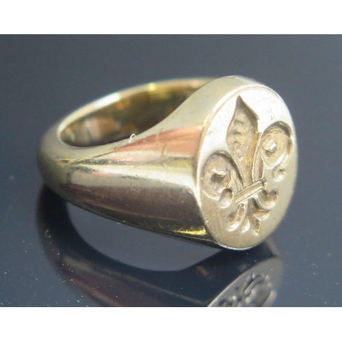 226 - A 9ct Gold Signet Ring engraved with a fleur-de-lis, size P.5, stamped marks, 14.73g and with a wax ... 