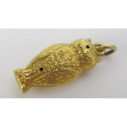 241 - An Antique Precious Yellow Metal Owl Charm with green paste eyes, KEE tests as 15ct, 0.62g
UNLESS OT... 