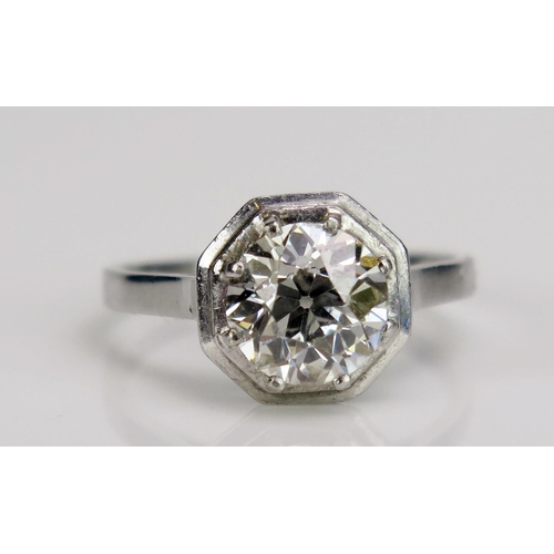 242 - A Diamond Solitaire Ring in a precious white metal setting with an hexagonal head, c. 7.6mm old Euro...