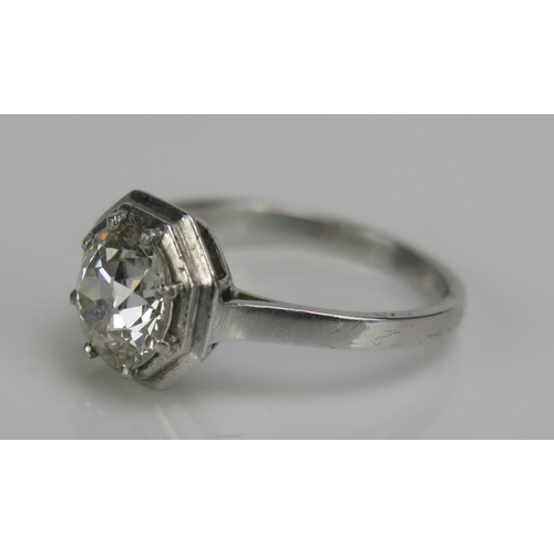 242 - A Diamond Solitaire Ring in a precious white metal setting with an hexagonal head, c. 7.6mm old Euro... 