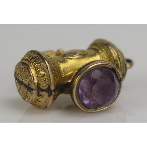 243 - An Antique Precious Yellow Metal and Amethyst Hand Lamp Charm, KEE tests as 9ct, 2.5g
UNLESS OTHERWI... 