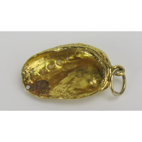 250 - A Precious Yellow Metal Sea Shell Charm or Pendant, KEE tests as 15ct, 29.2mm drop, 1.88g
UNLESS OTH... 