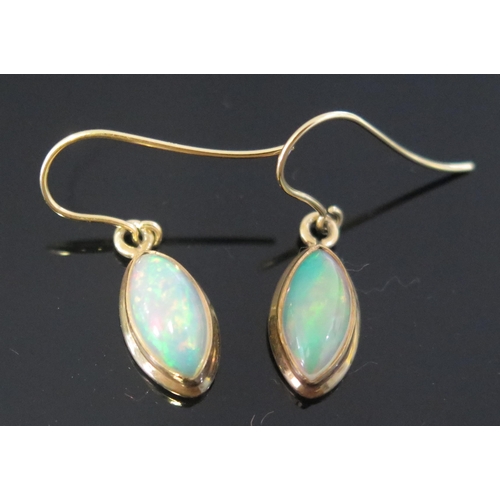 252 - A Pair of White Fire Opal Pendant Earrings in a silver gilt setting, 27.6mm overall drop, singlet sp... 