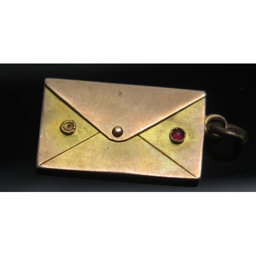 253 - An Antique Precious Yellow Metal Envelope Charm, KEE tests as 15ct, 2g
UNLESS OTHERWISE STATED THE K... 