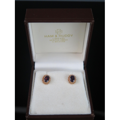 266 - A Pair of 9ct Gold and Amethyst Stud Earrings, c. 10.5x9mm, hallmarked, 1.61g