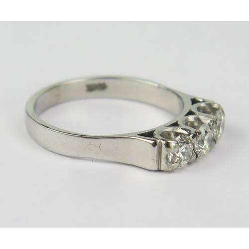 27 - An 18ct White Gold and Diamond Three Stone Ring, set with three c. 4.1mm brilliant round cut stones,... 