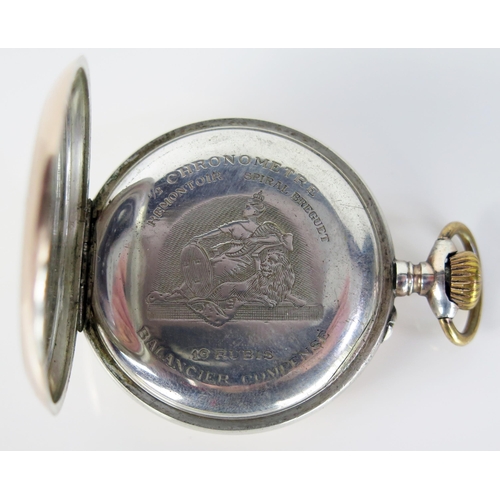 405 - A Silver and Gilt Open Dial Keyless Pocket Watch with engraved crest to the back, the dust plate eng... 