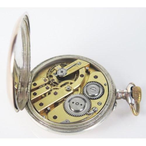 405 - A Silver and Gilt Open Dial Keyless Pocket Watch with engraved crest to the back, the dust plate eng... 