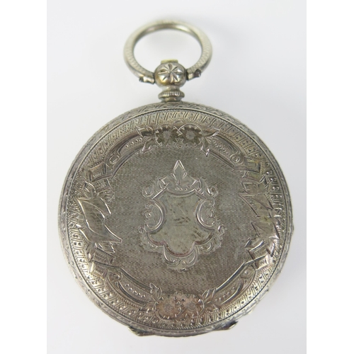 407 - A Silver cased Open Dial Key Wound Fob Watch with chased decoration, 38.2mm case. Needs attention