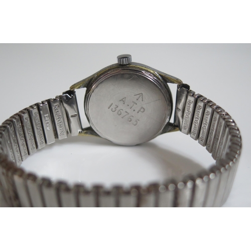 408 - A WWII TIMOR 'One of the Dirty Dozen' Wristwatch, 31mm case back marked A.T.P. 136765. Needs attenti... 