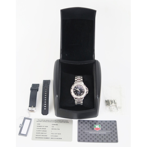 425 - A TAG Heuer Formula 1 Diamond Bezel Black Dial Wristwatch on TAG steel bracelet together with box, g... 