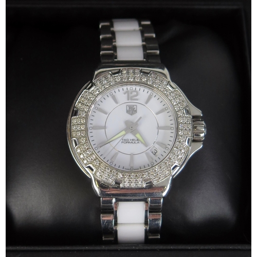 427 - A TAG Heuer Formula 1 Diamond Bezel White Dial Wristwatch on TAG steel and white ceramic bracelet to... 