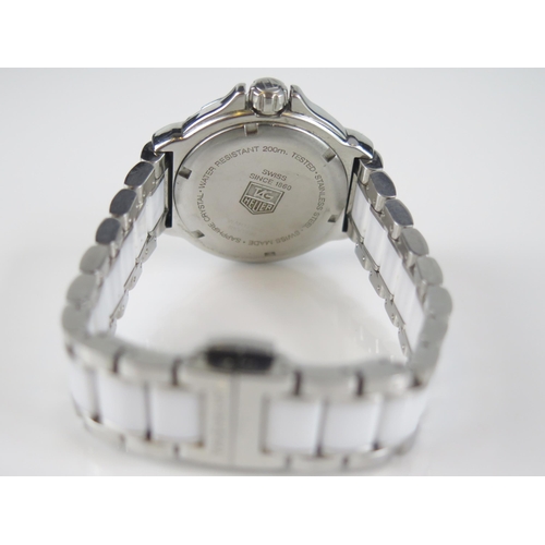 427 - A TAG Heuer Formula 1 Diamond Bezel White Dial Wristwatch on TAG steel and white ceramic bracelet to... 