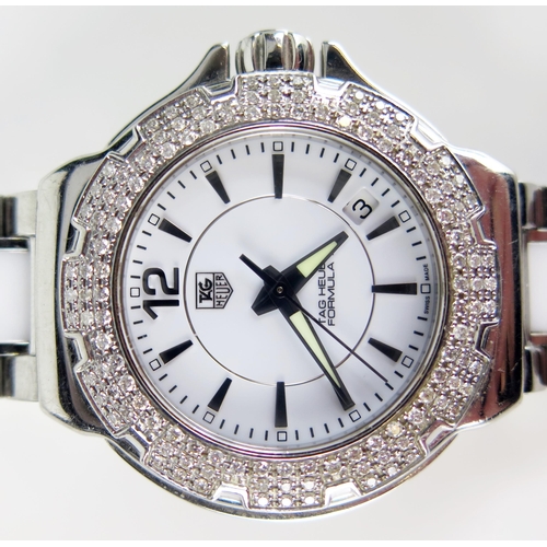 427 - A TAG Heuer Formula 1 Diamond Bezel White Dial Wristwatch on TAG steel and white ceramic bracelet to... 