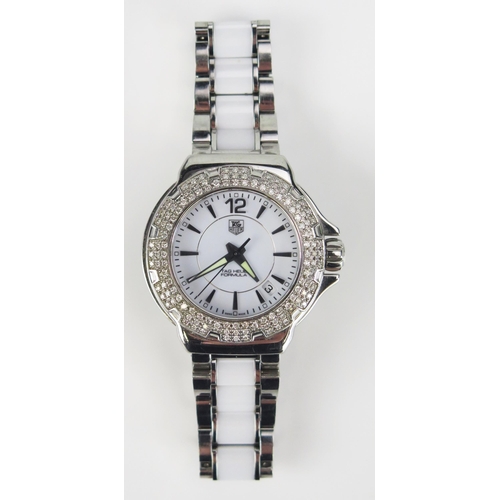 427 - A TAG Heuer Formula 1 Diamond Bezel White Dial Wristwatch on TAG steel and white ceramic bracelet to... 