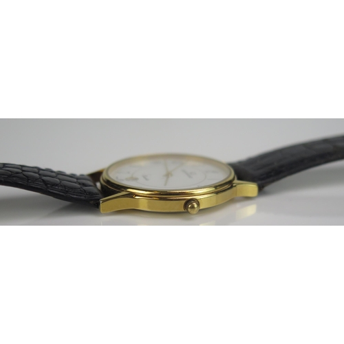 437 - A GARRARD Gold Plated Quartz Wristwatch, 33mm case. Running