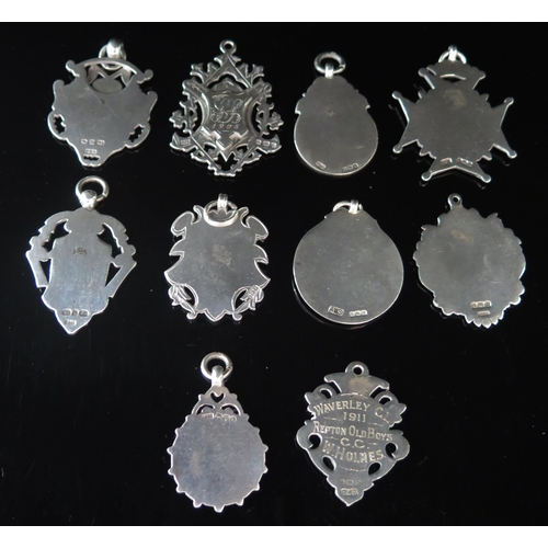 564 - Ten assorted silver fobs and medallions, various makers and dates, total weight of silver 117gms, 3.... 