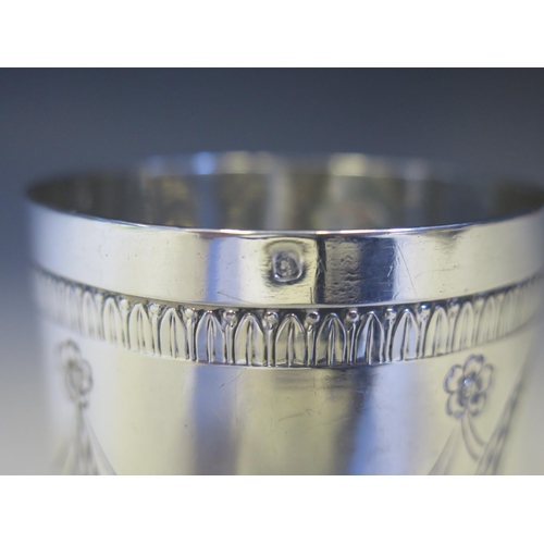 605 - A French silver tumbler, maker LB, of cylindrical tapering form, with repousse garland and ribbon ti... 