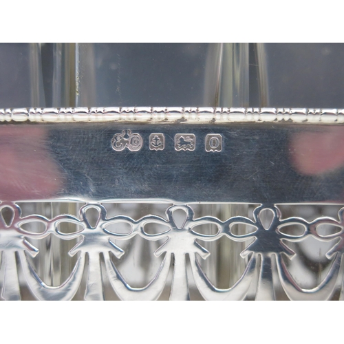 610 - A George V silver scent bottle stand, maker Elkington & Co, Birmingham, 1913, of rectangular outline... 