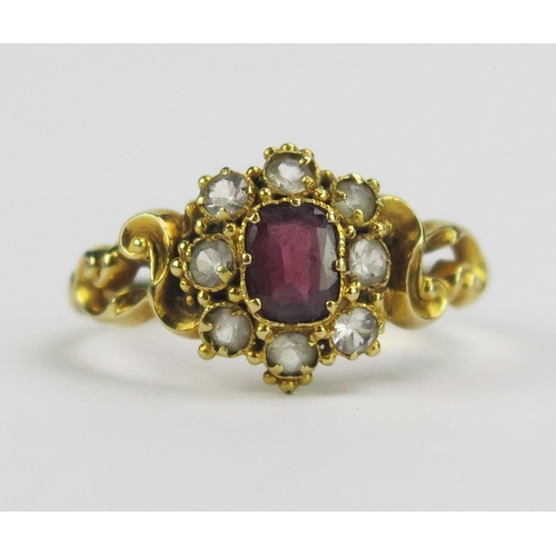 63 - A 19th Century Precious Yellow Metal and Paste Ring with pierced rococo scroll shoulders, size N.25,... 