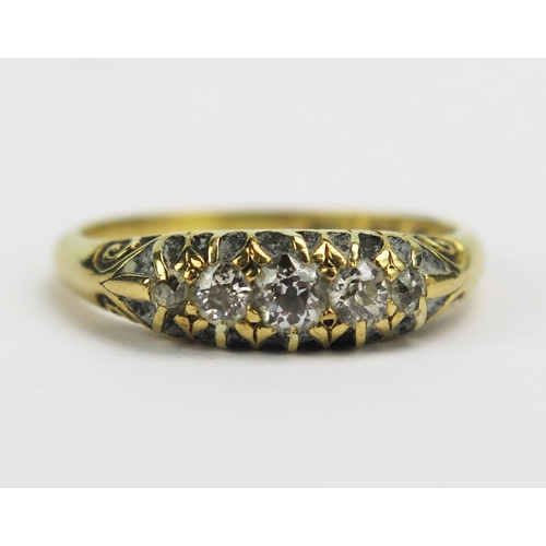 65 - A Victorian 18ct Gold and Diamond Five Stone Ring, largest old cut c. 3.65mm claw set with chased sc... 