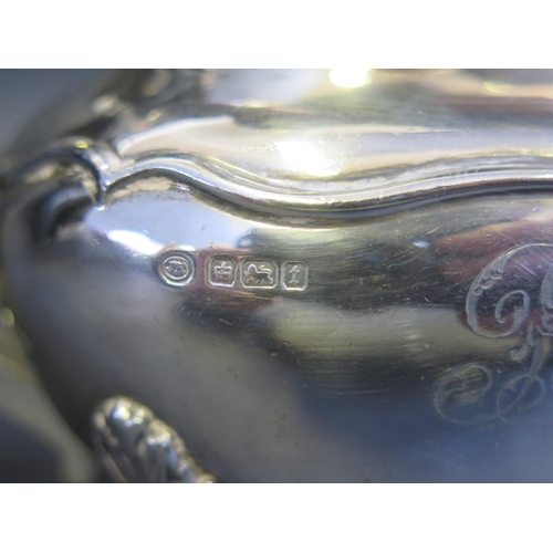 691 - A George V silver bachelors teapot, maker John Round & Son Ltd, Sheffield, 1911, monogrammed, of ova... 