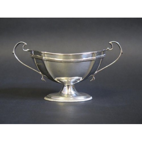 693 - A George V silver twin handled sugar basin, maker Roberts & Belk, 1918, of oval outline, raised on a... 